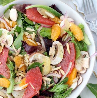 This delicious Winter Citrus Salad with Red Wine Vinaigrette is packed with seasonal Mandarin oranges and grapefruit. It's tossed with thinly sliced mushrooms, toasted almonds, and a versatile red wine vinaigrette, and is a great recipe for meal prepping!