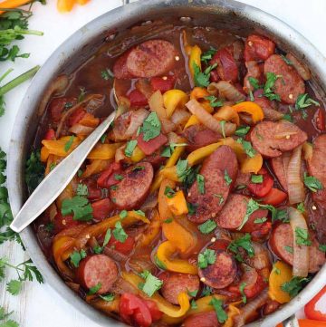 This one-pot Sweet and Spicy Sausage with Peppers and Onions is super easy to make with only four main ingredients, and delicious served over cooked rice or quinoa! It's sweetened with just a touch of honey and has a kick from crushed red pepper.