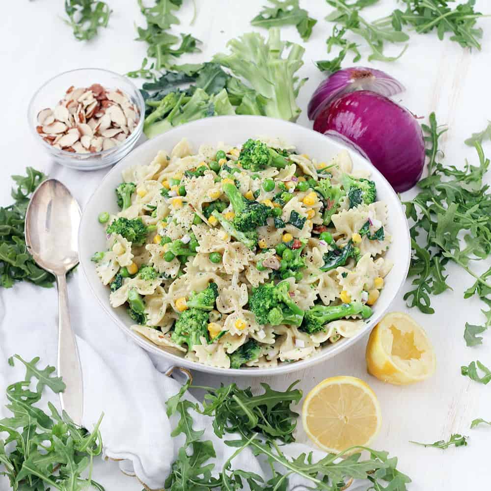 This creamy lemony vegetable pasta salad recipe is a cinch to make- the vegetables boil directly in the pasta water for less effort and clean up. Tossed in a light lemon garlic mayo and olive oil dressing, this is the perfect vegetarian make-ahead side or light meal.