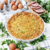 This crustless ham and zucchini quiche recipe is a great way to use up leftover ham  and feed a crowd easily! It can be served at room temperature so you can easily make it ahead of time.