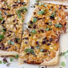 This Feta and Sun Dried Tomato Tart recipe is the perfect vegetarian appetizer or light meal. It's easy to make using filo (phyllo) dough, or even puff pastry. 