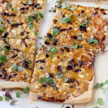 This Feta and Sun Dried Tomato Tart recipe is the perfect vegetarian appetizer or light meal. It's easy to make using filo (phyllo) dough, or even puff pastry.