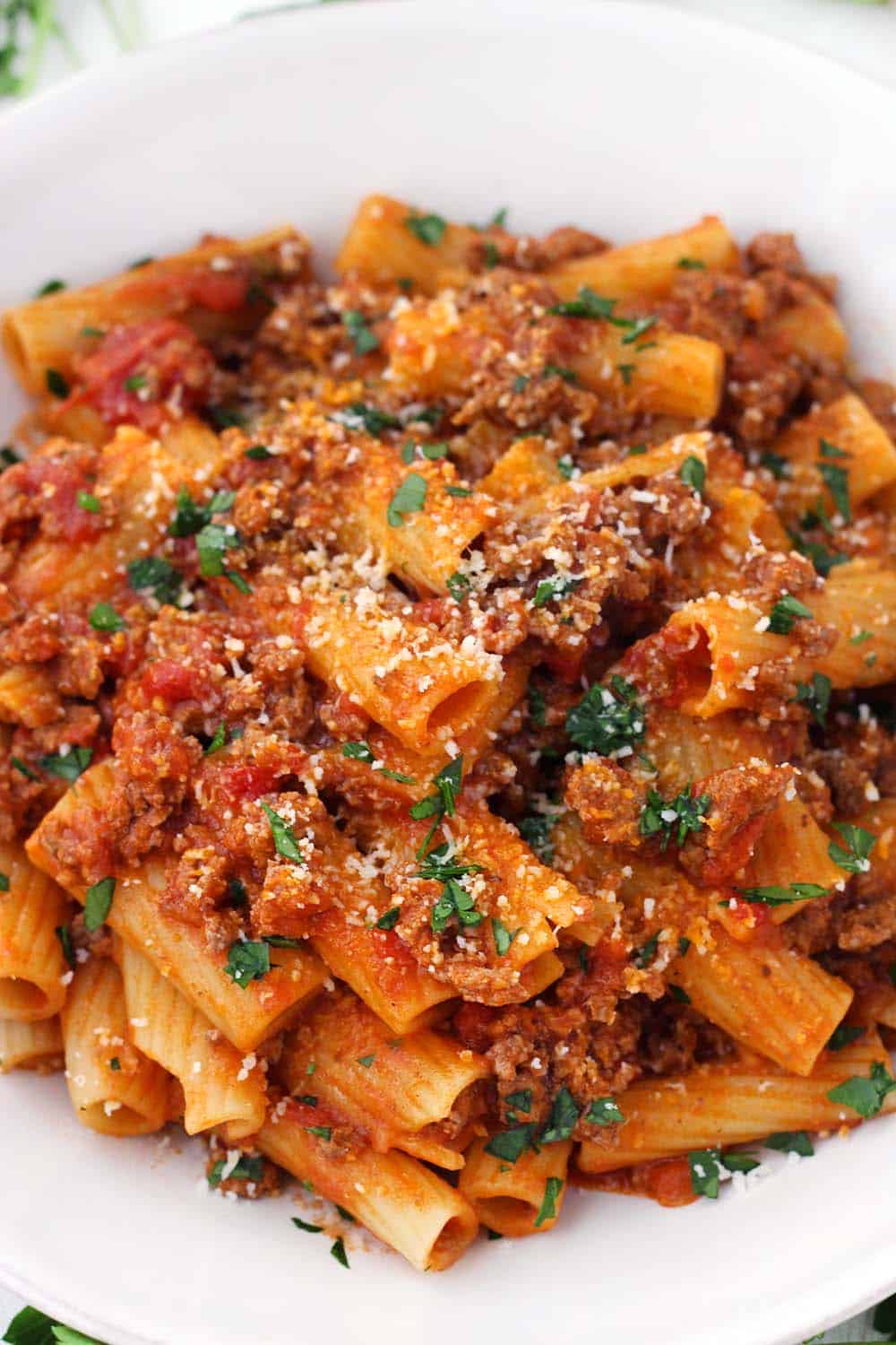 With a few tricks and only five ingredients, you can make the BEST Pasta with Bolognese sauce at home- the kind where the sauce clings to every piece of pasta and has the most authentic Italian taste!