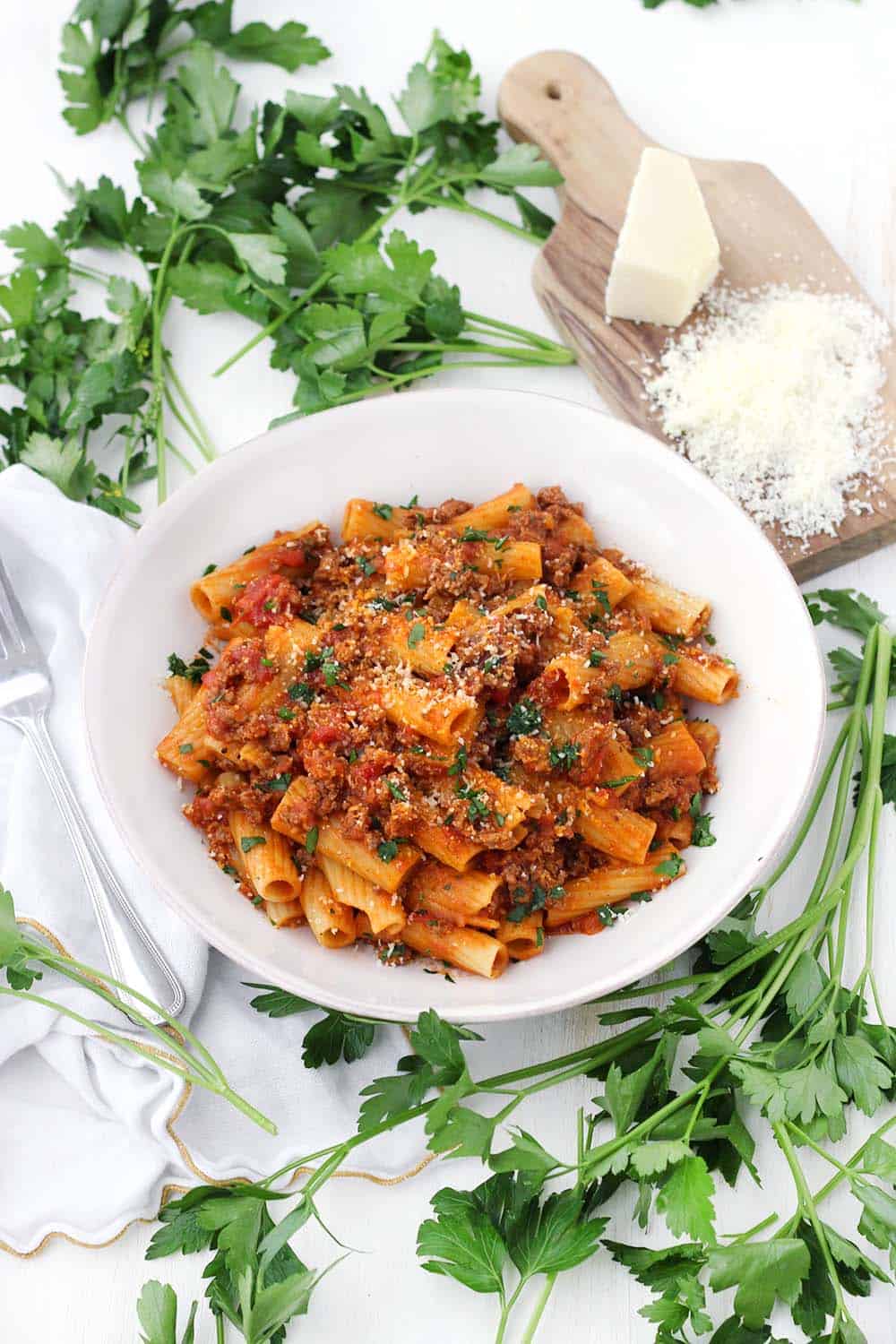 With a few tricks and only five ingredients, you can make the BEST Pasta with Bolognese sauce at home- the kind where the sauce clings to every piece of pasta and has the most authentic Italian taste!