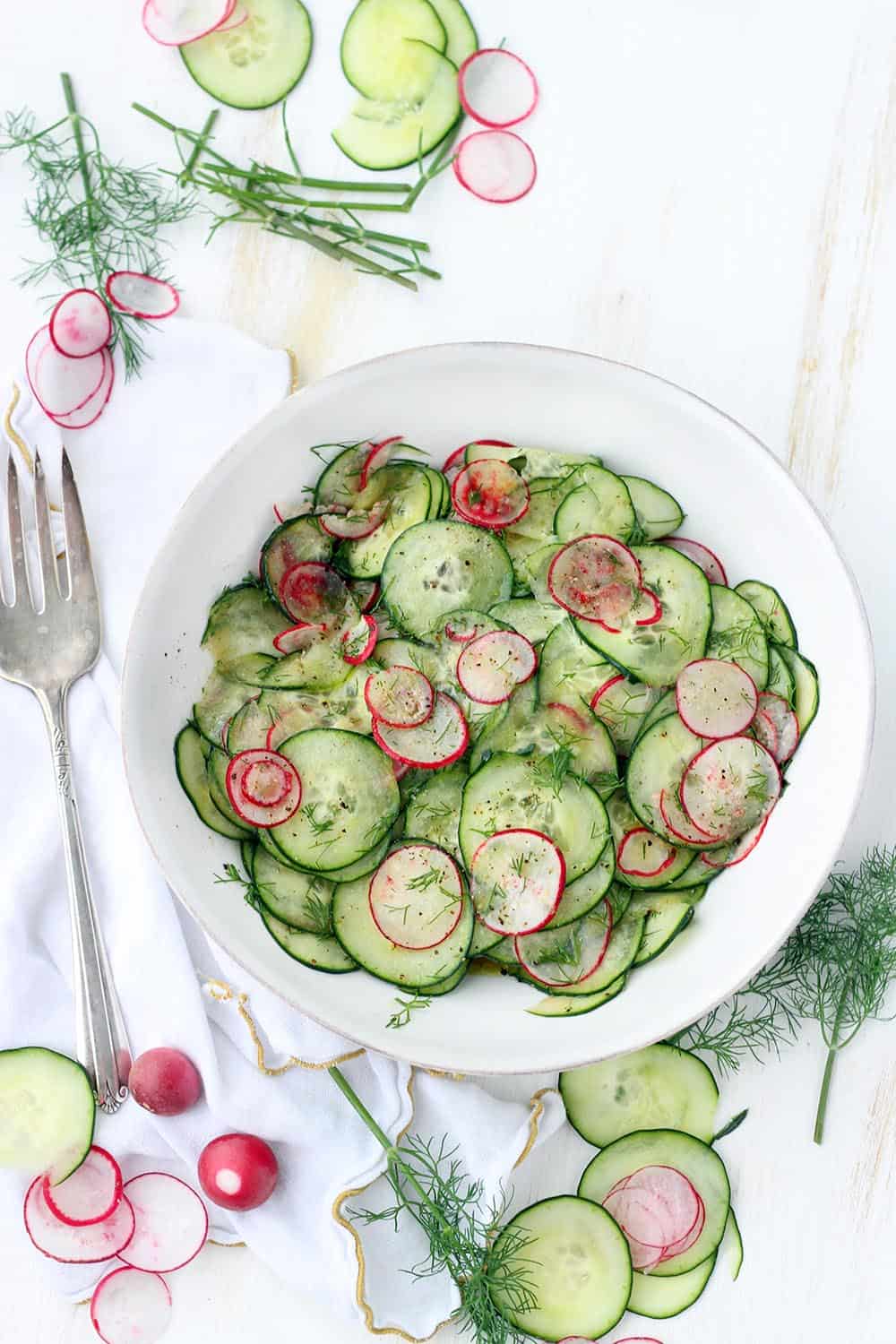 This Cucumber and Radish Salad with Dill is dressed in a sweet and tangy red wine vinaigrette and is addicting! A perfect low-carb, refreshing side that can easily be made ahead of time. 