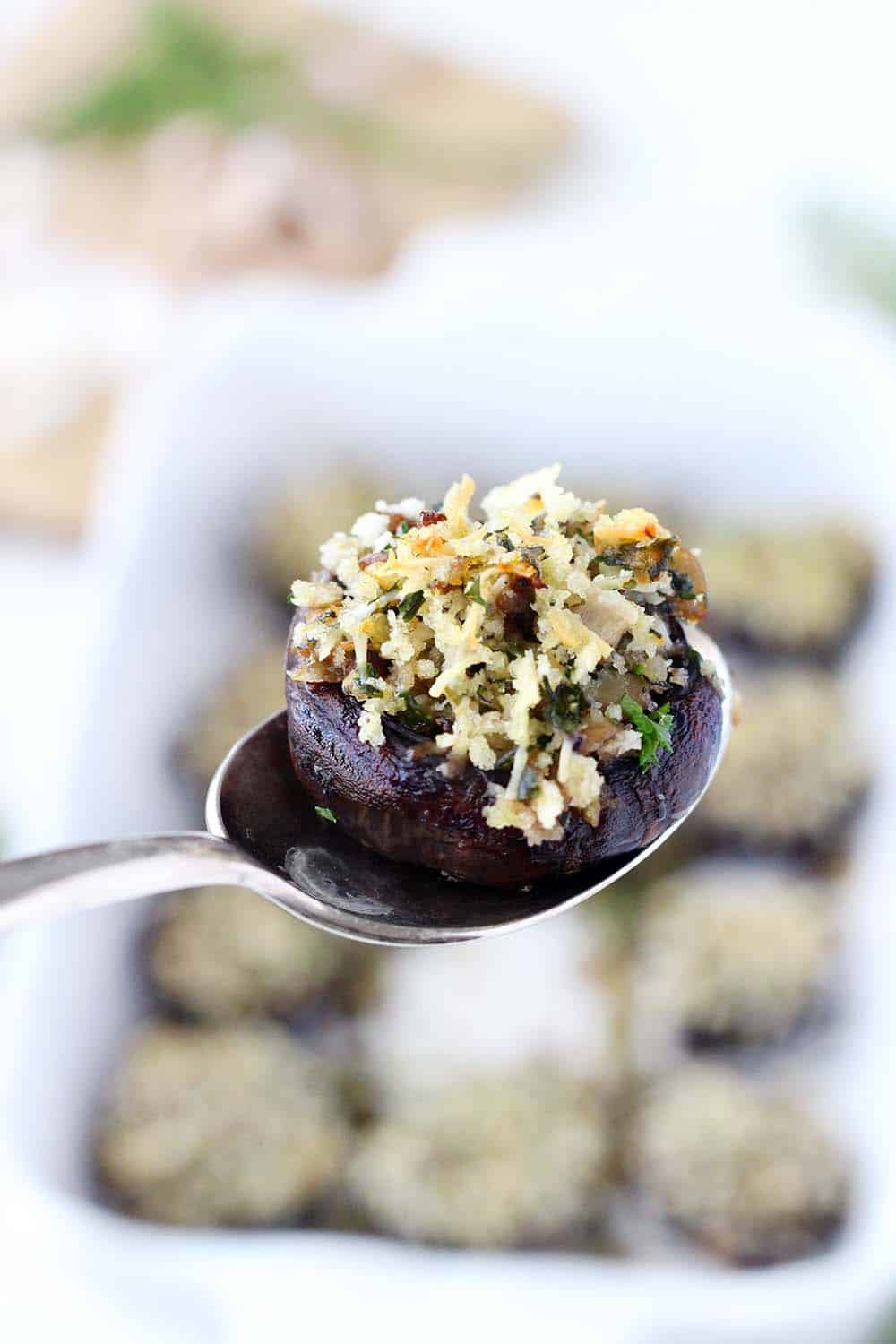 These Italian Vegetarian Stuffed Mushrooms are a great make-ahead recipe for dinner or an appetizer! They're packed with flavor from the fresh herbs, shallots, garlic, and parmesan cheese. 