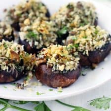 These Italian Vegetarian Stuffed Mushrooms are a great make-ahead recipe for dinner or an appetizer! They're packed with flavor from the fresh herbs, shallots, garlic, and parmesan cheese. 