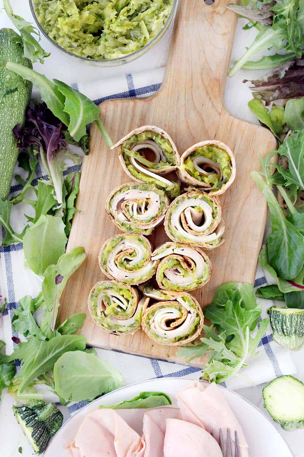 These Turkey Roll-Ups are spread with yummy, veggie-packed Zucchini Butter instead of mayo for an easy meal-prep sandwich for lunches all week long! Great for back-to-school and super kid friendly. Use any leftover zucchini butter in an omelette, as a dip, or to stuff chicken breasts.