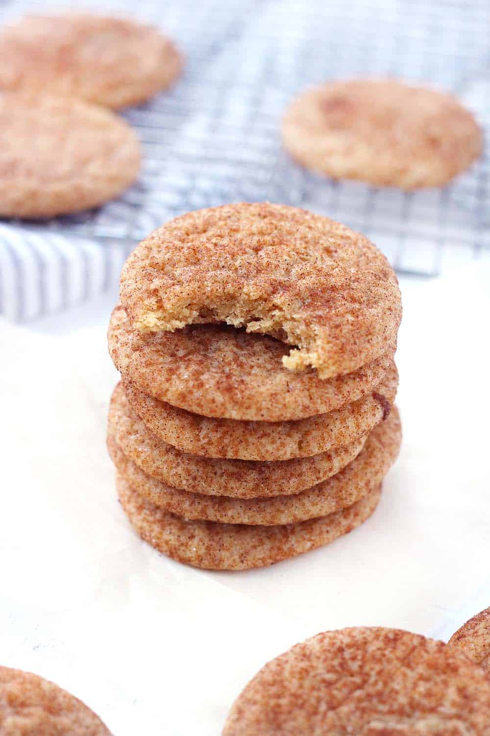These Pumpkin Spice Snickerdoodles have warming pumpkin pie spices in the batter and are rolled in a mixture of brown and white sugars with cinnamon and more pumpkin pie spice! There's NO actual pumpkin used in this recipe. Make in bulk and keep in your freezer for a fun fall treat!