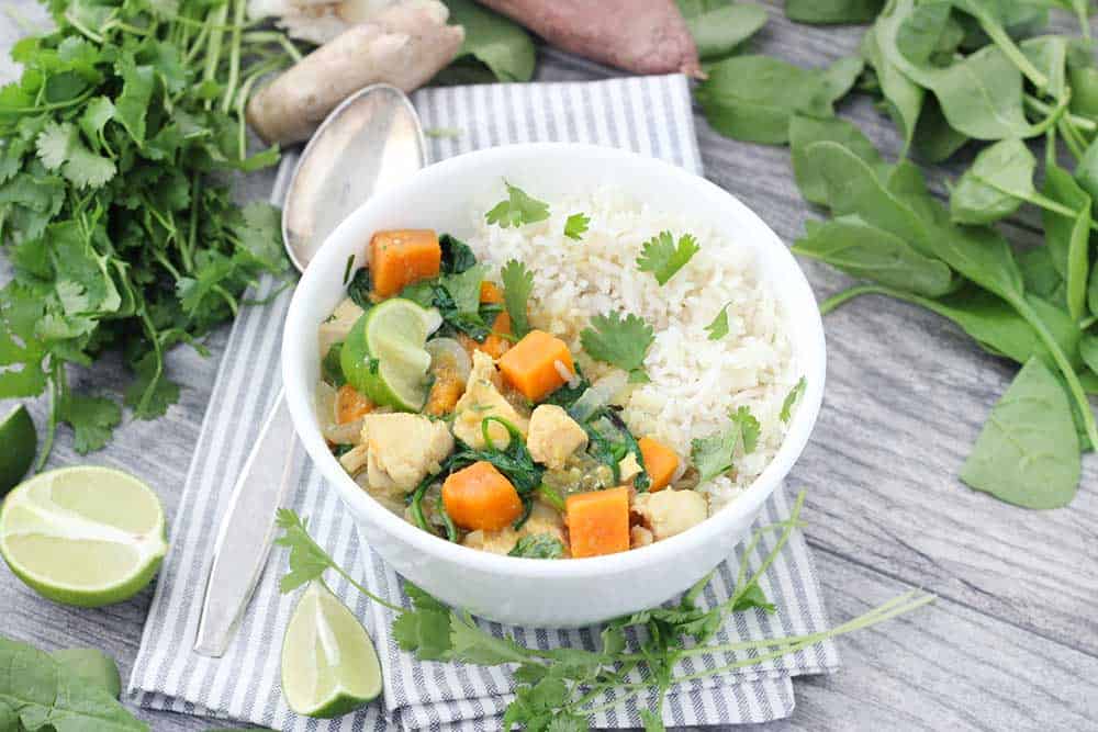 Green Chicken Curry with Sweet Potatoes and Spinach is such an easy, flavor-packed, veggie-packed recipe! This version is dairy free, gluten free, and paleo/whole30 compliant.
