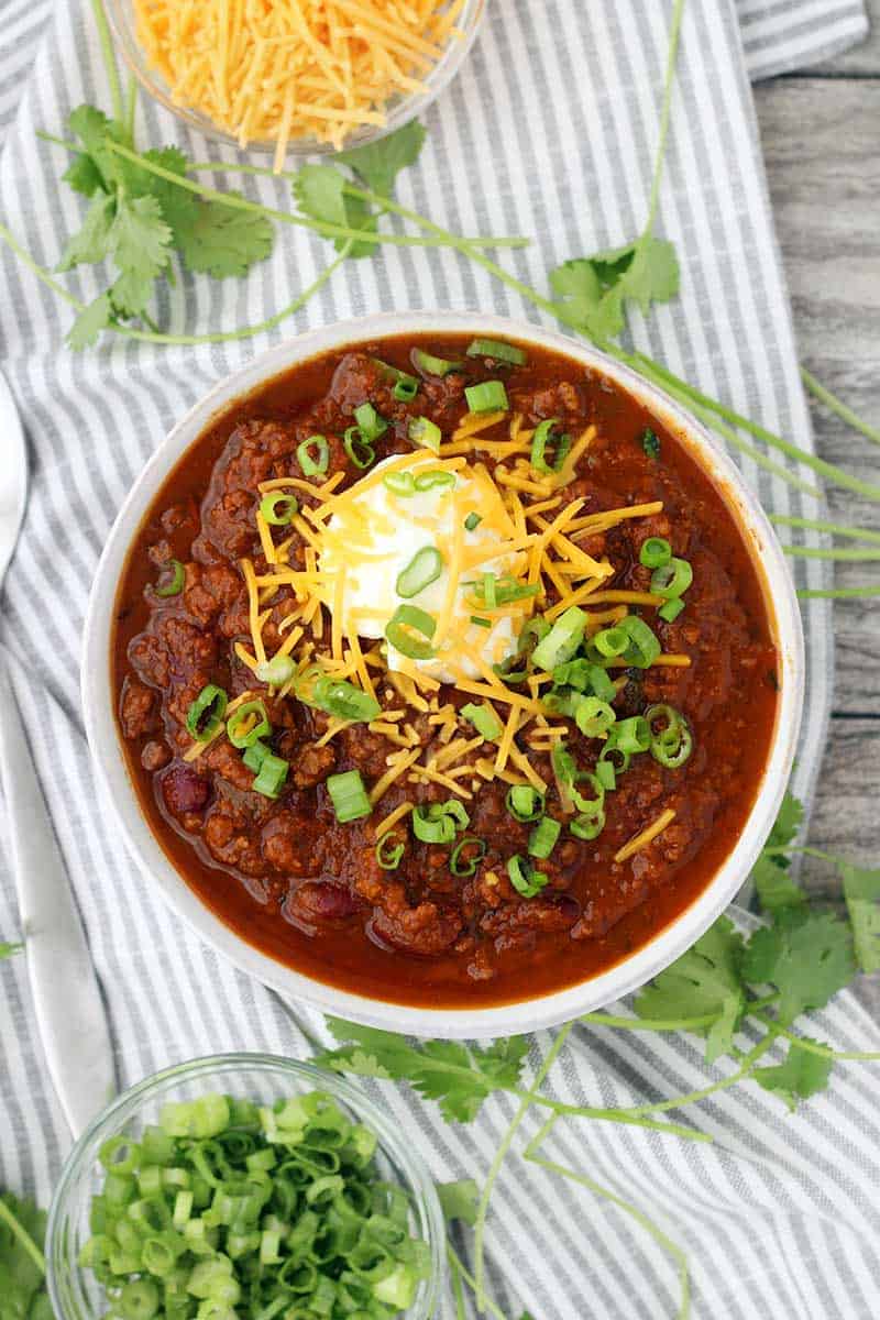 Instant Pot Pumpkin Chili is so easy to make and packed with fall flavors from pumpkin pie spices and apple cider! This recipe uses a whole can of pumpkin and is slightly sweet, slightly spicy, and tastes smooth and velvety. 