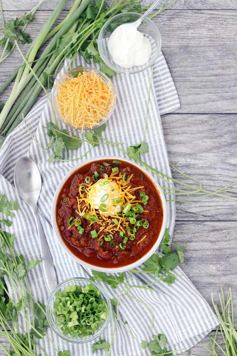 Instant Pot Pumpkin Chili is so easy to make and packed with fall flavors from pumpkin pie spices and apple cider! This recipe uses a whole can of pumpkin and is slightly sweet, slightly spicy, and tastes smooth and velvety. 