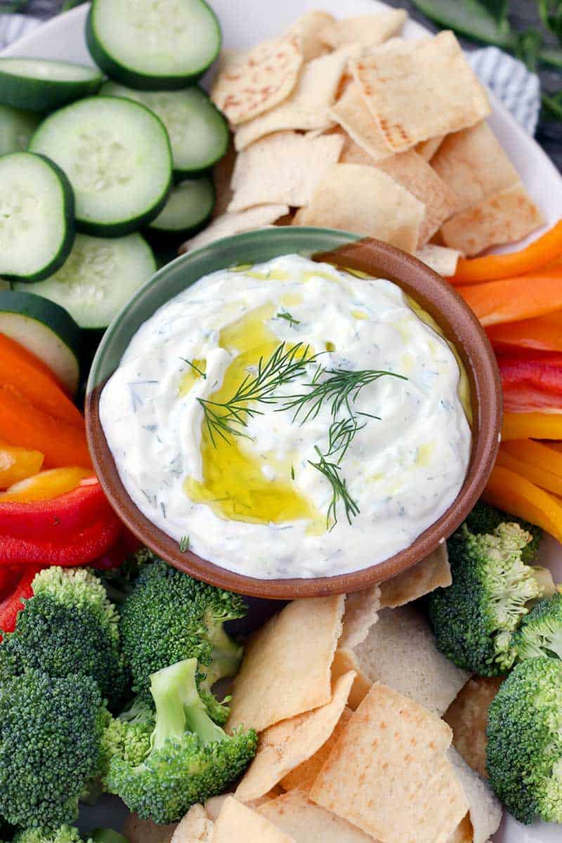 This Authentic Tzatziki Sauce (Greek Cucumber Yogurt Sauce) is SO easy to make! Use as a dip, as a spread on sandwiches or gyros, or mix into chicken or tuna salad.