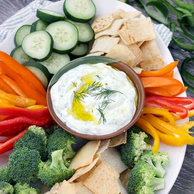 This Authentic Tzatziki Sauce (Greek Cucumber Yogurt Sauce) is SO easy to make! Use as a dip, as a spread on sandwiches or gyros, or mix into chicken or tuna salad.