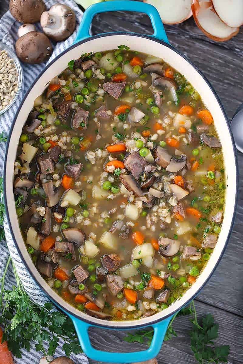 Overhead photo of a Dutch oven with beef barley soup.