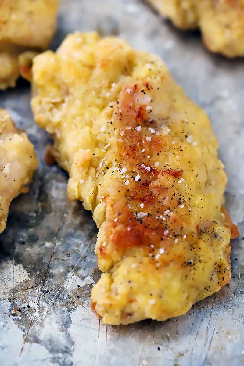 Close up photo of an oven baked chicken tender.