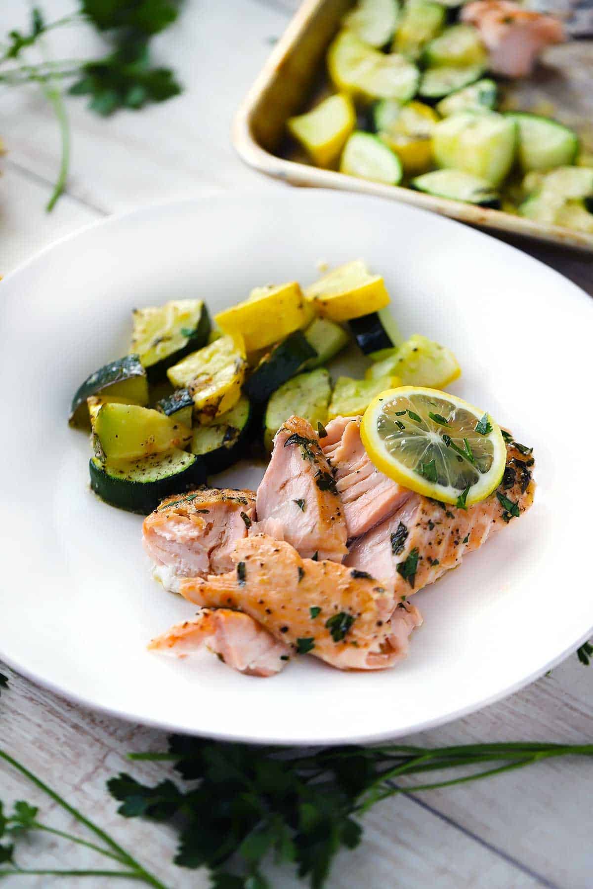 Salmon, zucchini, and summer squash on a plate