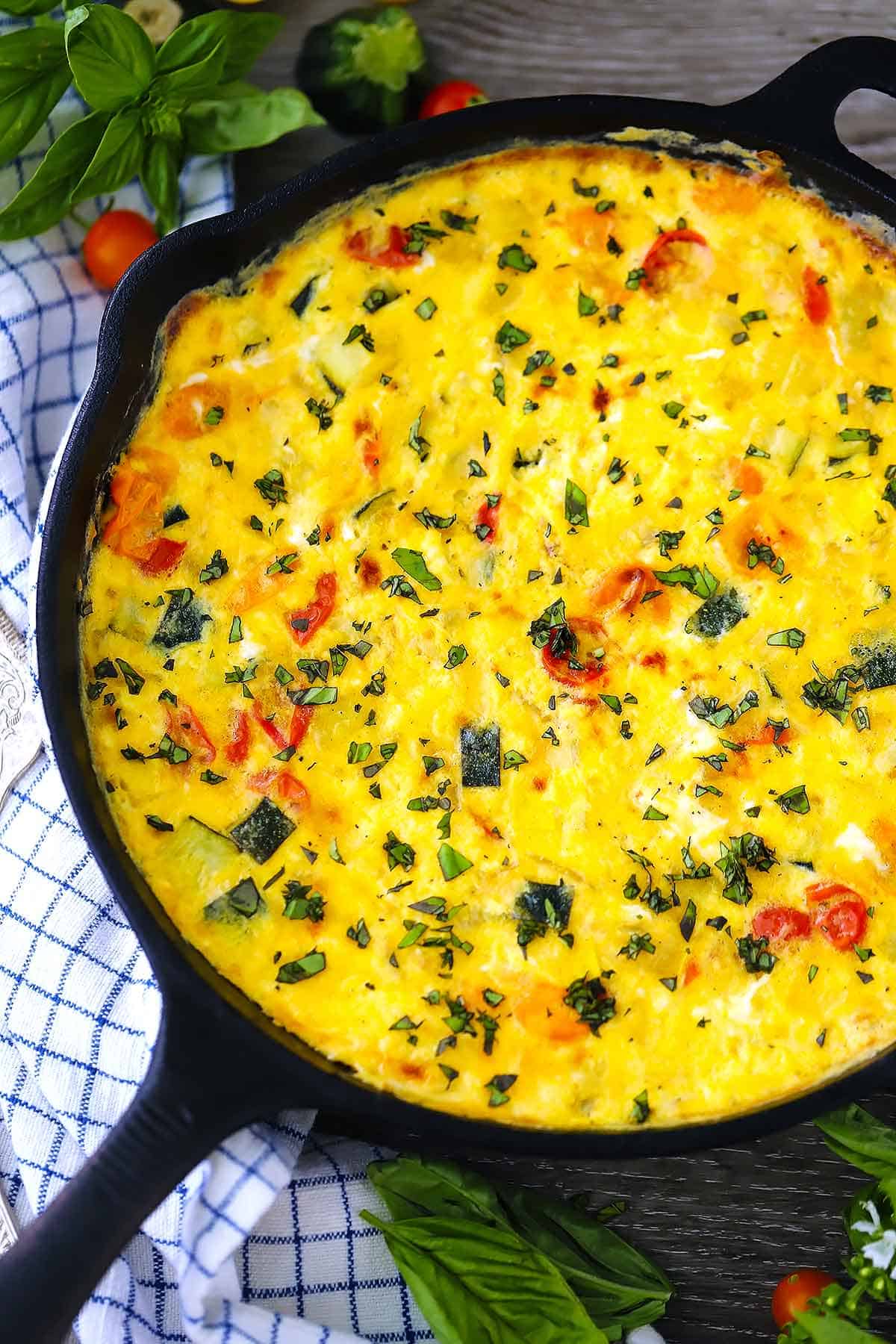A vegetable frittata in a cast iron skillet