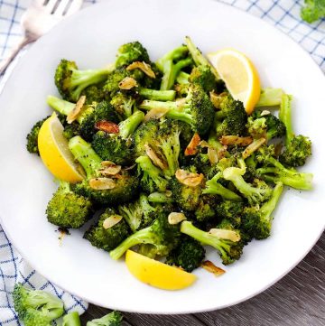 Roasted Broccoli with Garlic and Lemon on a white plate.