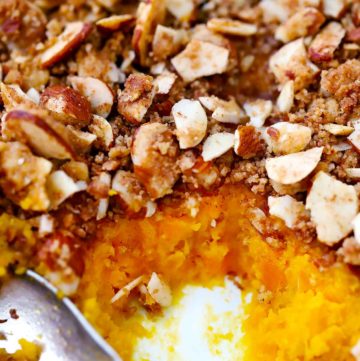 Close up photo of sweet potato casserole with streusel topping.
