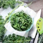 Prepped kale in a container square image.