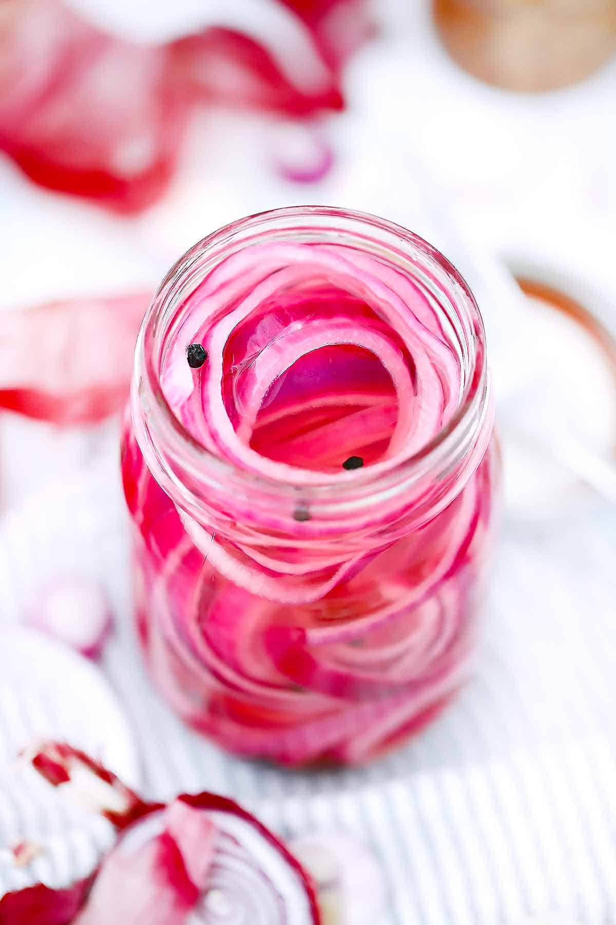 Quick pickled red onions in a mason jar.