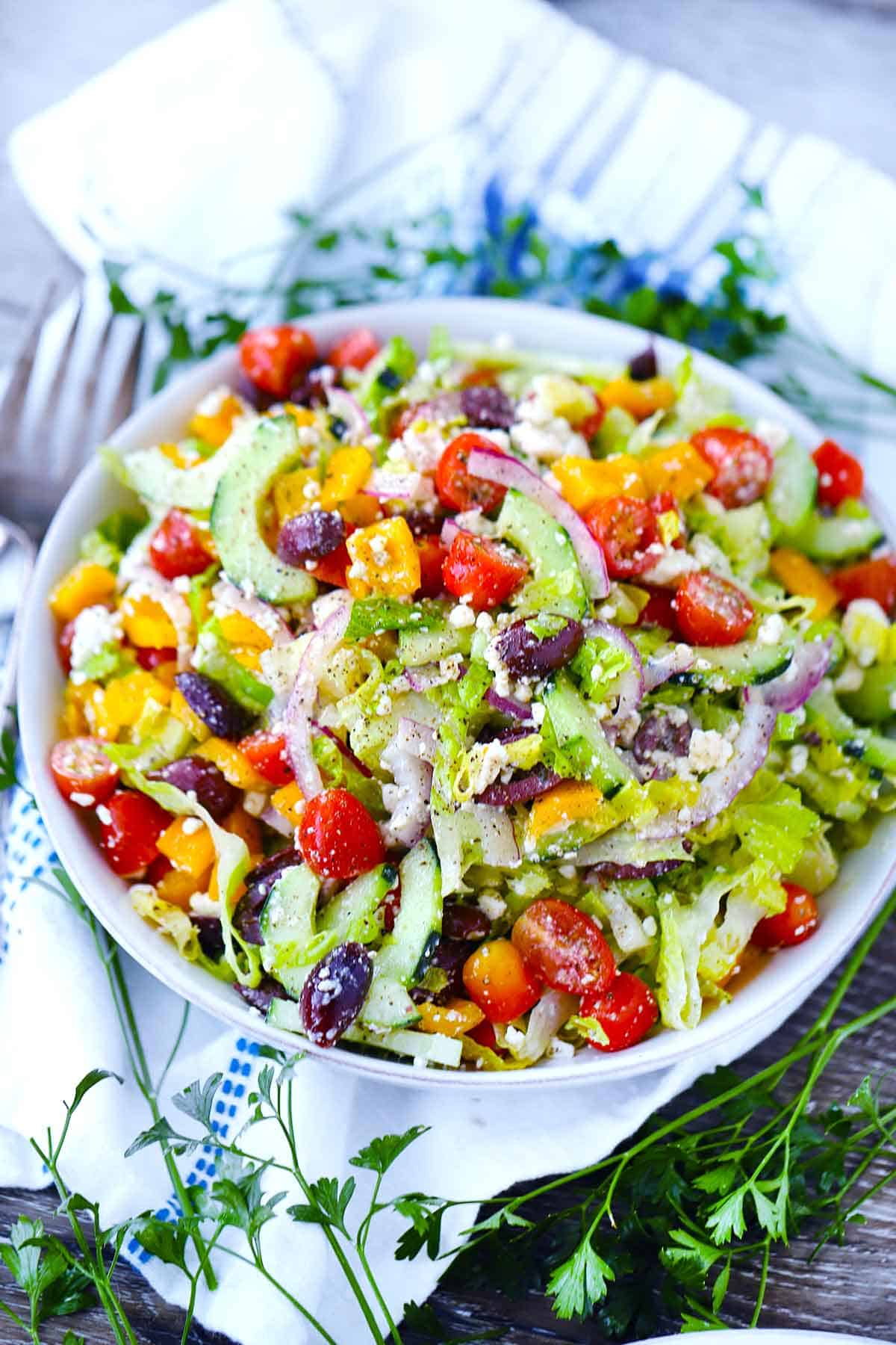 A white bowl with Greek salad.