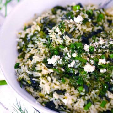 Square photo of Spanakorizo (Greek spinach and rice with lemon and dill).