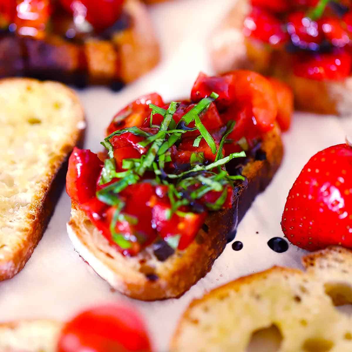 Strawberry Bruschetta with Tomatoes and Basil on Homemade Crostini