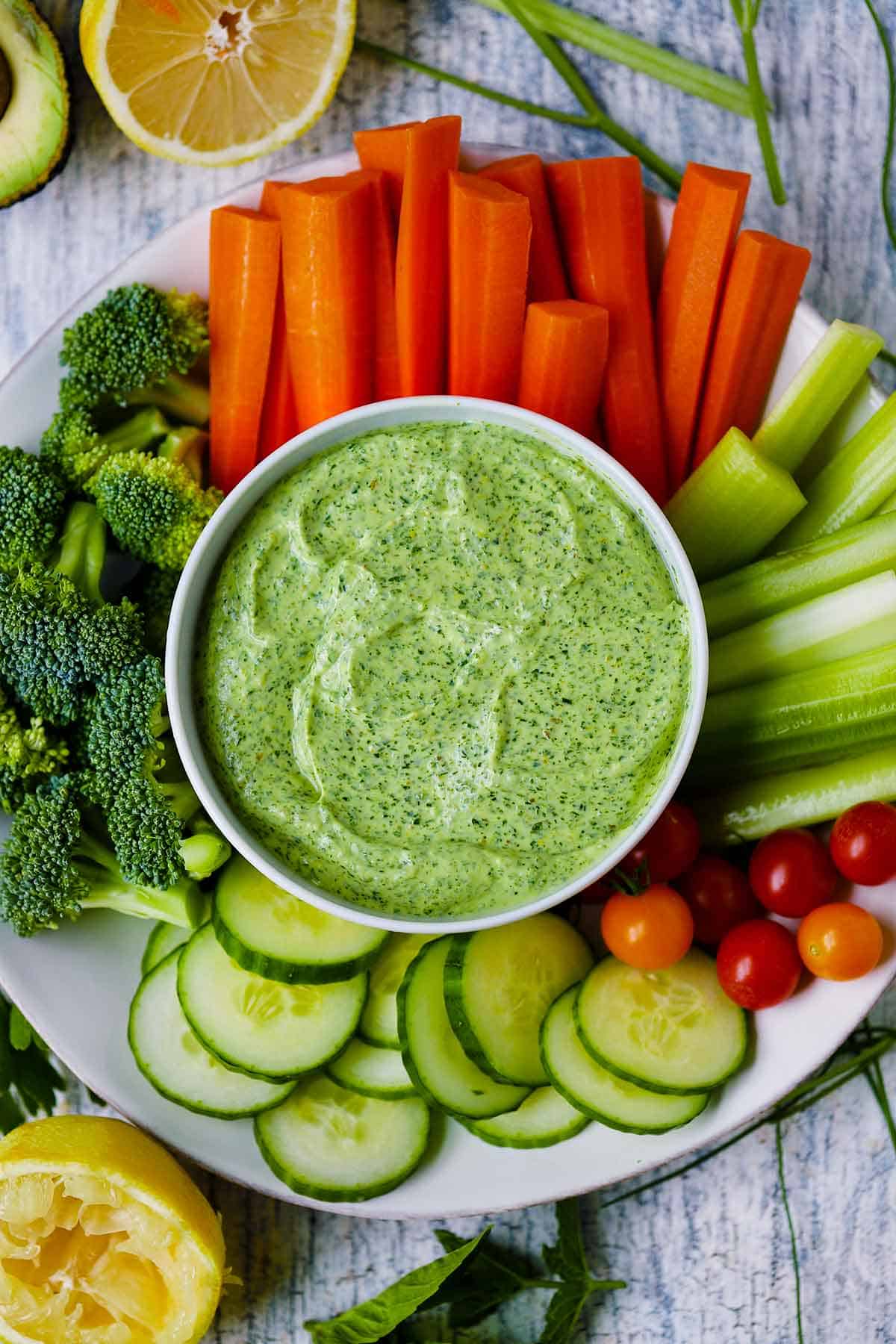 Overhead photo of Green Goddess Dressing with crudités for dipping.