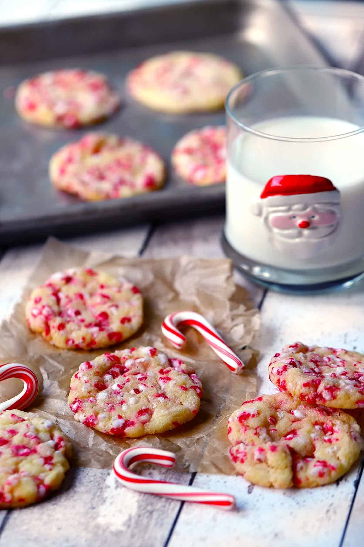 Peppermint cookies and milk in a santa glass.