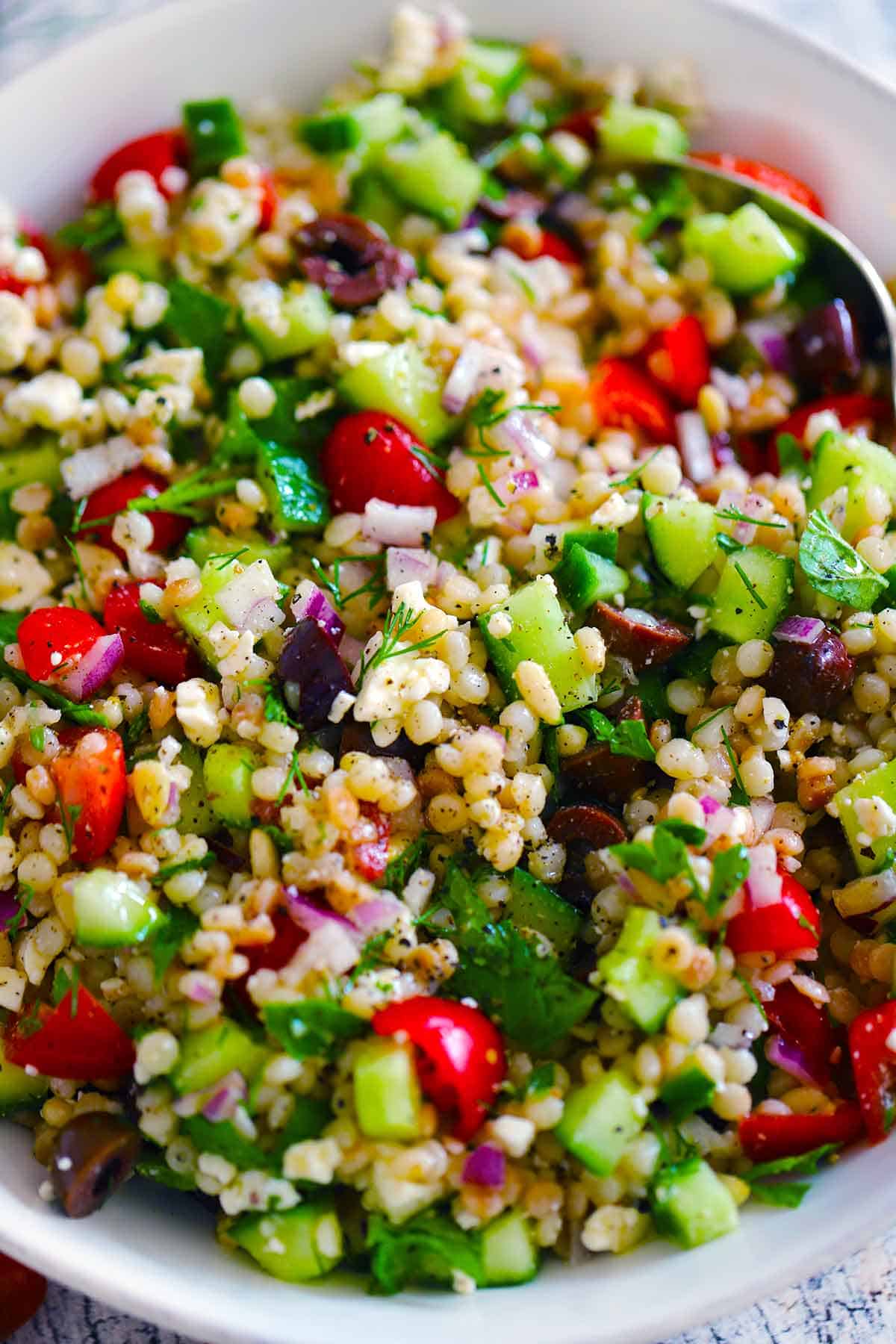 Close up photo of pearl couscous salad.